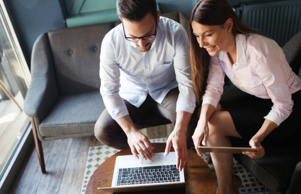istock Workteam in office working together on laptop 903326960