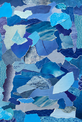 collage mood board with blue colors . The sheet is made of teared old paper of magazines and printed matter