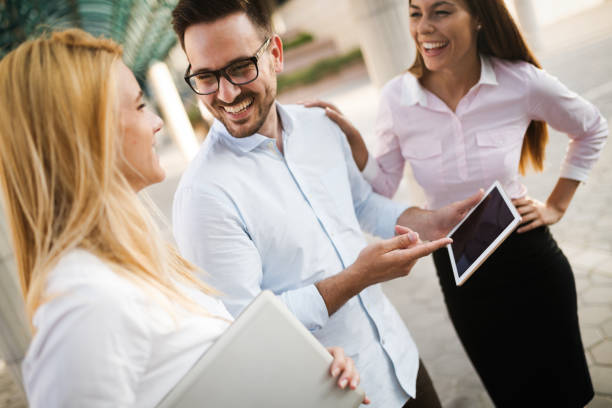 istock Happy business colleagues in modern office 903330078