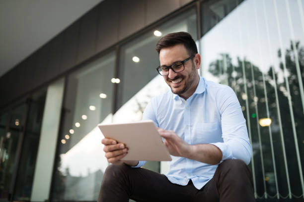 istock Businessman having tablet and phone at hand 903334936