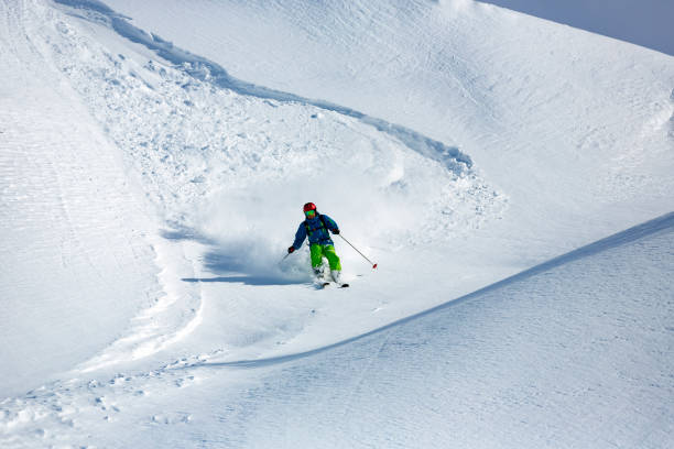 istock Freeride skier in fresh powder snow 903338614