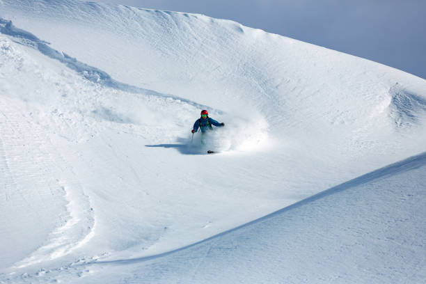 istock Man skier running downhill on Alpine slope 903339044
