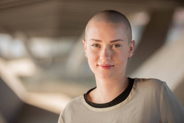 istock young woman smiling into the camera 903346926