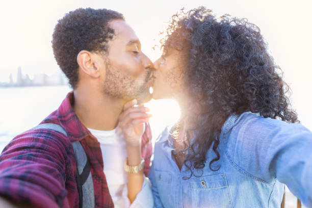 istock Couple kiss on a romantic date 903353128