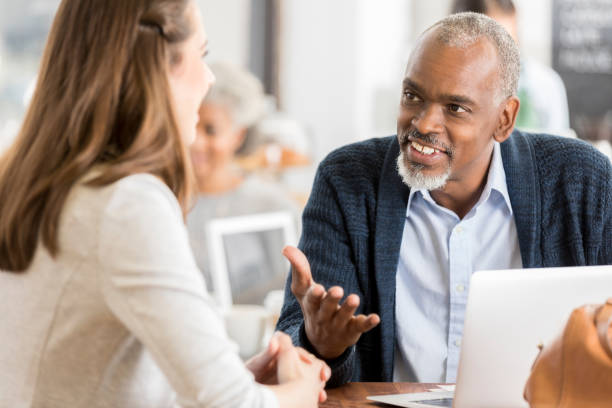 istock Businesspeople meet in coffee shop before work 903353214