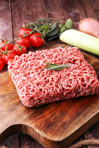 istock Raw pork and beef ground meat and vegetables. 903353238