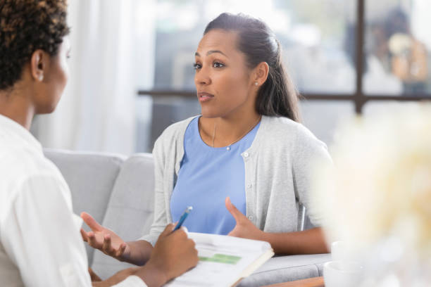 istock Female patient discusses something with therapist 903353736