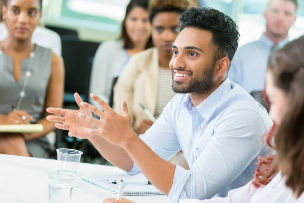 istock Confident young businessman participates in seminar 903354104