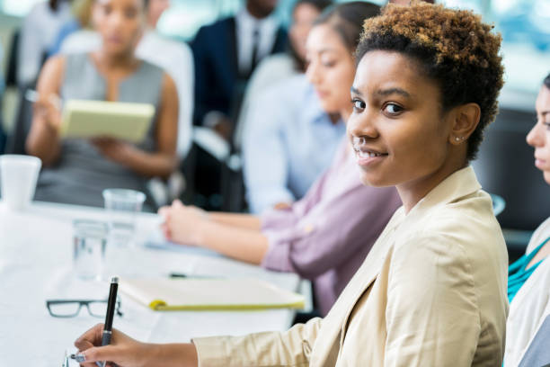 istock Confident African American woman takes notes during seminar 903354130