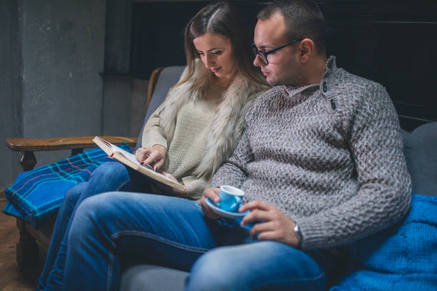 istock Couple Of Students Learning At Home On A Sofa 903354326