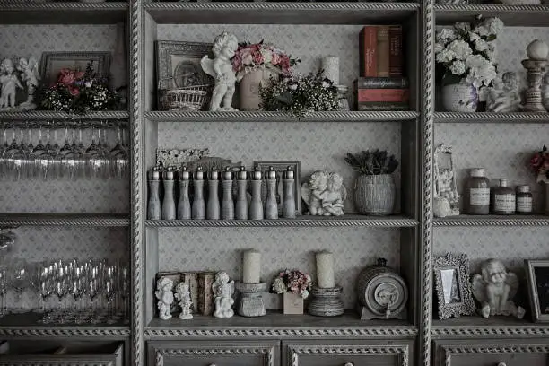 Photo of Kitchen utensils in a vintage cabinet in a restaurant