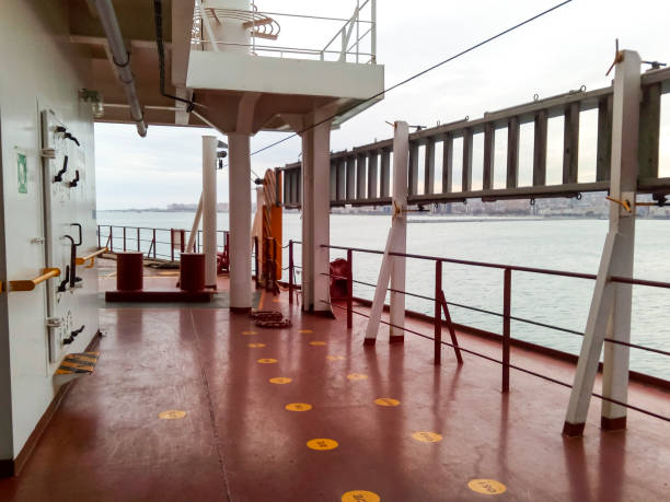 istock The deck of a cargo ship. Red floor and white walls. 903360990