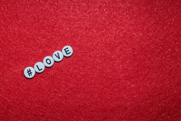 love letter on a red background, letters in the form of plastic buttons with a sign hashtag - splitup imagens e fotografias de stock