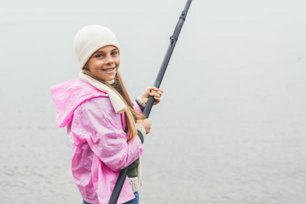 istock fishing little girl 903372740