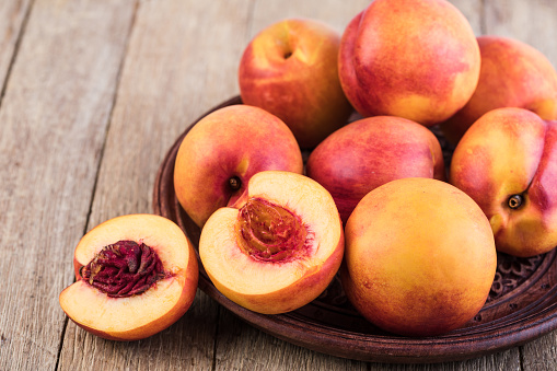 Nectarine fruit on a wooden