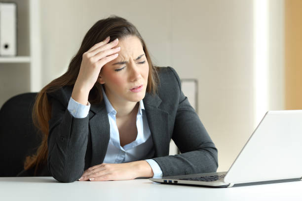 istock Businesswoman suffering migraine at office 903375492