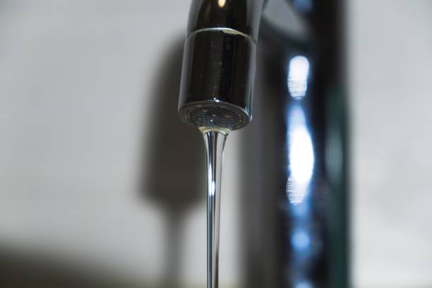 istock Water leaking from faucet to sink. 903375812