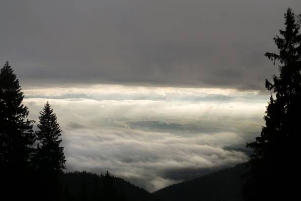istock Sunrise on hills with clouds above. 903378526