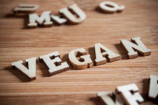 istock concept word vegan writing on wooden cutting board 903378764