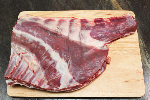 A whole raw breast of Welsh lamb