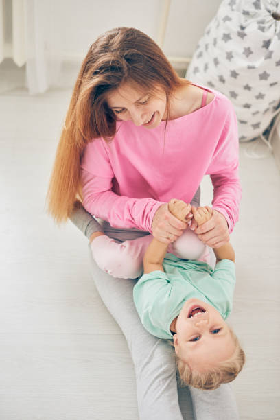 istock Mother and daughter playing 903389878