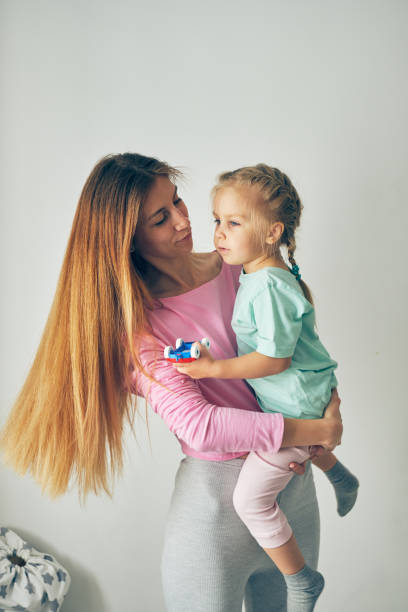 istock Mother and daughter playing 903389908
