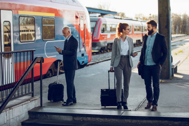 istock Senior businessman using mobile phone at train station 903390954