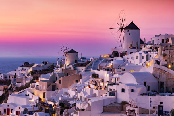 istock Sunset over the windmills of Oia, Santorini 903401000