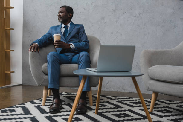 istock Middle aged businessman with coffee 903405198