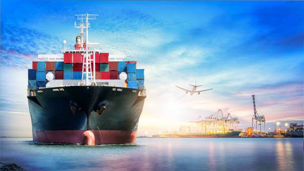 istock Logistics and transportation of International Container Cargo ship and cargo plane in the ocean at twilight sky, Freight Transportation, Shipping 903405586