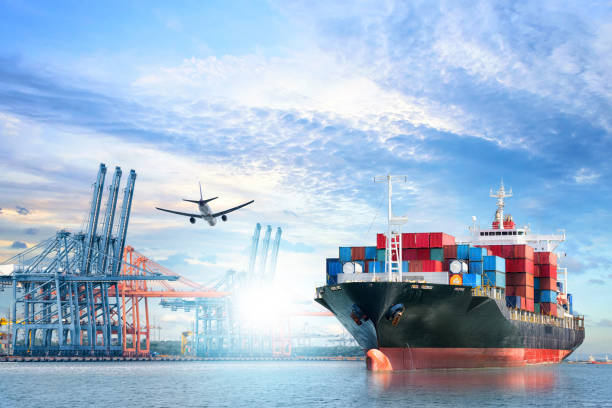 istock Logistics and transportation of International Container Cargo ship and cargo plane in the ocean at twilight sky, Freight Transportation, Shipping 903406624
