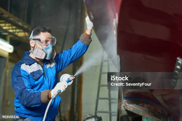 Worker Spray Painting Boats In Workshop Stock Photo - Download Image Now - Painting - Activity, Nautical Vessel, Industry