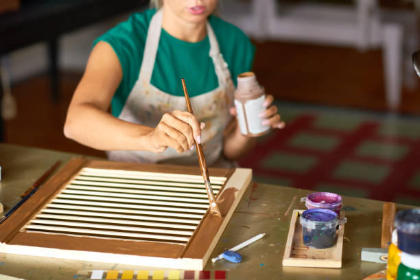 istock Young Woman Making DIY Interior Decoration 903413606