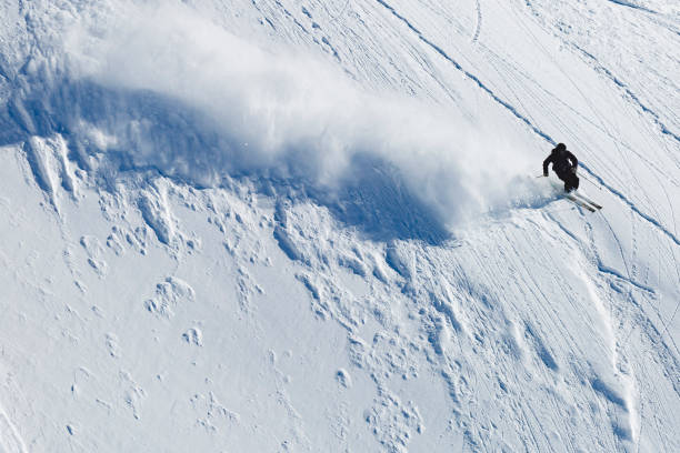 istock Man Athlete freeriding in fresh powder snow 903413686
