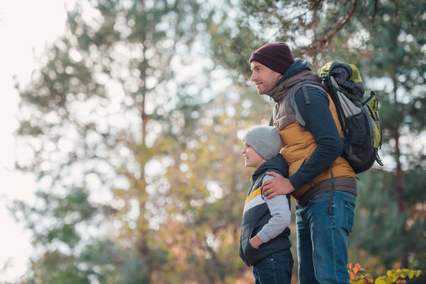 istock father and son hiking together 903416440