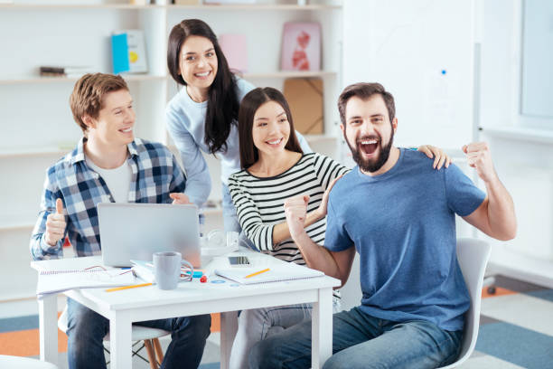 istock Positive four colleagues gaining profit 903416620