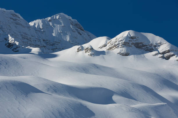 Low angle view of snow-capped mountains in Dolomites