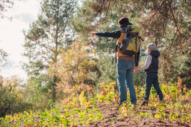 istock father and son hiking together 903417328
