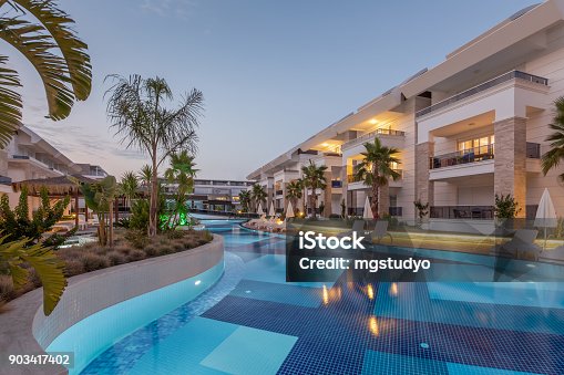 istock Luxury Construction hotel with Swimming Pool at sunset 903417402