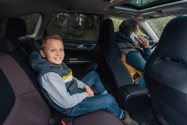 istock father and son in car 903420286