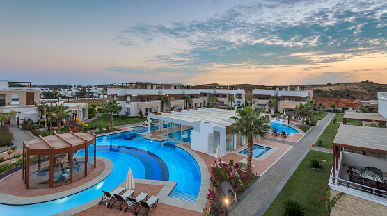 Luxury Construction hotel with Swimming Pool at sunset aerial view