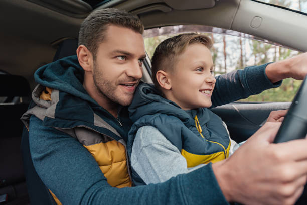 istock father and son in car 903424386