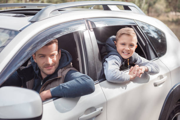 istock father and son in car 903427378