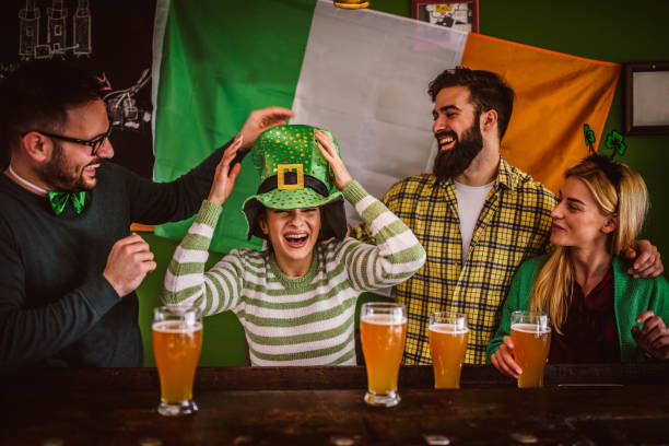 istock Group of Friends Celebrating St Patrick's Day at Beer Pub 903427738
