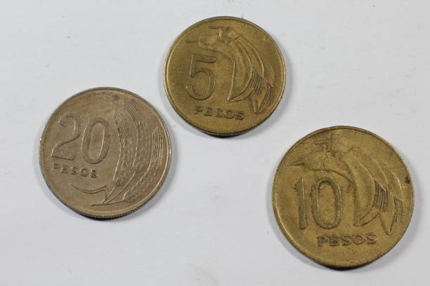 istock Old coins from Uruguay isolated on white background 903431688