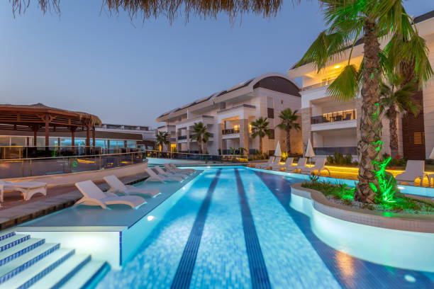 istock Luxury Construction hotel with Swimming Pool at sunset 903431738