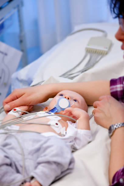 istock Selective focus of sick infant boy undergoing a electrocardiography to check his heart. 903432146