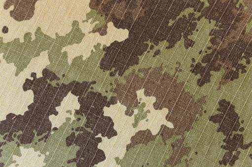 Military vegetato camuflaje rip-Fondo de textura de la tela photo