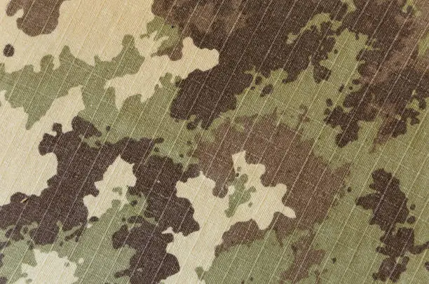 Military vegetato camouflage rip-stop fabric texture background