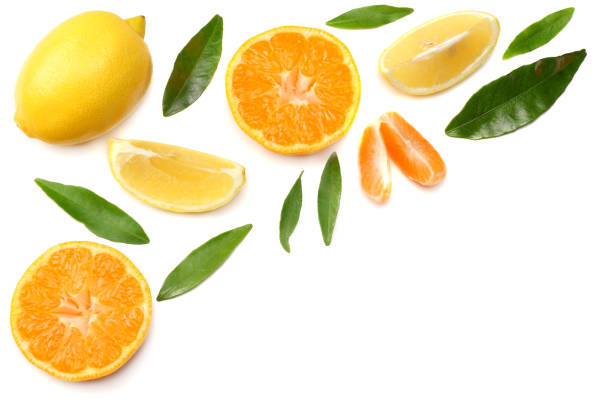 istock mandarin with slices, lemon and green leaf isolated on white background top view 903438508